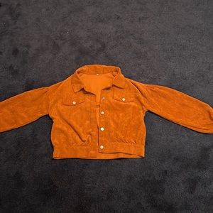 Cute orange/brown jean jacket. Super cozy and feels great.